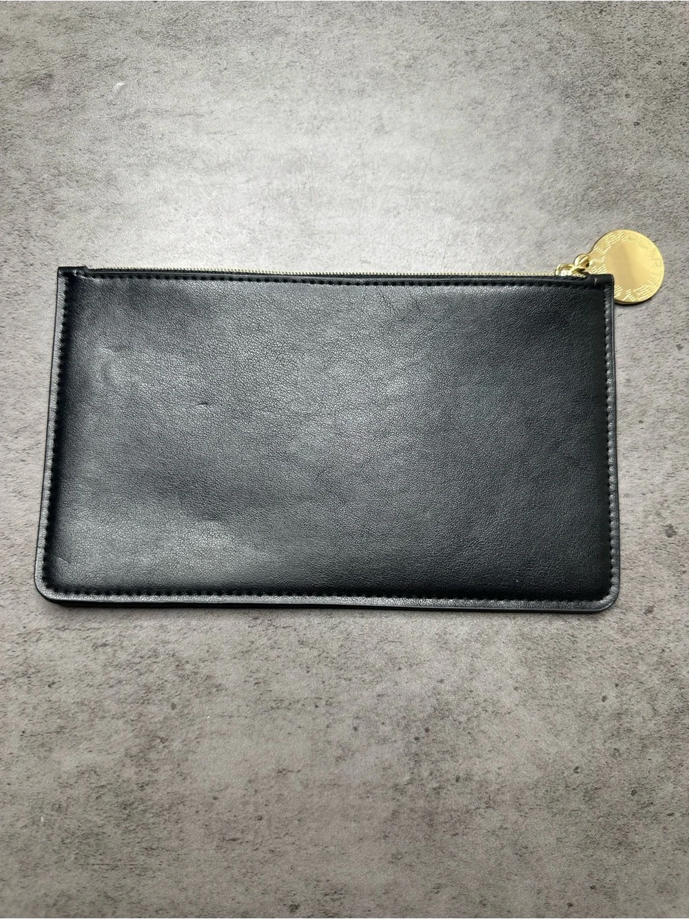 Stella McCartney Black Zip Pouch with Gold Medallion Charm